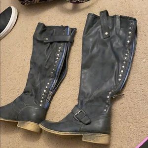 Tall black boots with blue zipper
